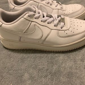 All white low top Air Force 1s